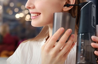 a person using a earwax removal kit