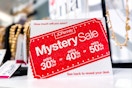 jcpenney mystery coupon sign on store shelf