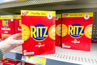 hand grabbing a box of ritz crackers