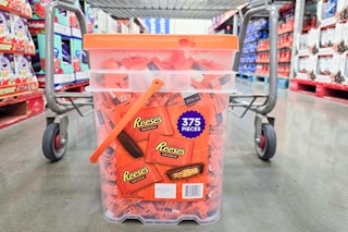bucket of reeses on the floor by a sams club cart