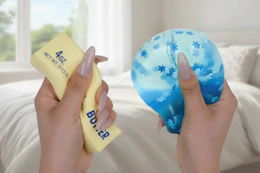 a woman squeezing squishy toys