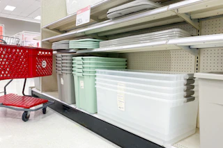 a shelf at target containing assorted brightroom storage bins with a sale sign