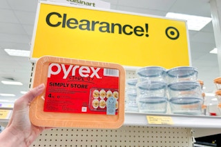 hand holding a pyrex simply store set in front of a target clearance sign
