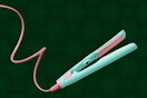 Stock image of the Flower Travel Flat Iron (teal/pink)