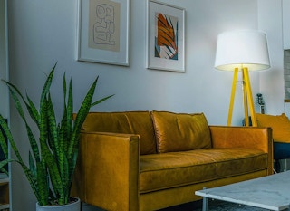 A living room with a bright lamp illuminating the area