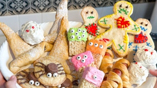 a platter full of halloween themed treats and snacks