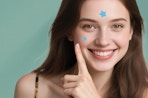 a person with blue star pimple patches on their face