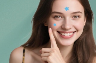 a person with blue star pimple patches on their face