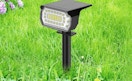 a solar spotlight in the grass