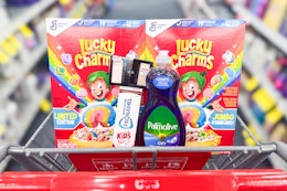lucky charms cereal, sensodyne toothpaste, palmolive dish soap, and maybelline eyeshadow in a cart