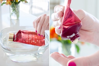 Someone putting the tube in a bowl of water and squeezing lotion into their hand.