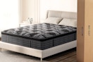 Lifestyle image of the Behost Queen Mattress (with box next to a bed)