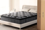 Lifestyle image of the Behost Queen Mattress (with box next to a bed)