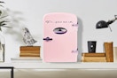 Lifestyle image of a pink Frigidaire Retro Mini Fridge