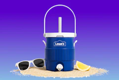 Lowe's blue mini cooler with sunglasses and a lemon slice on a beach-themed background