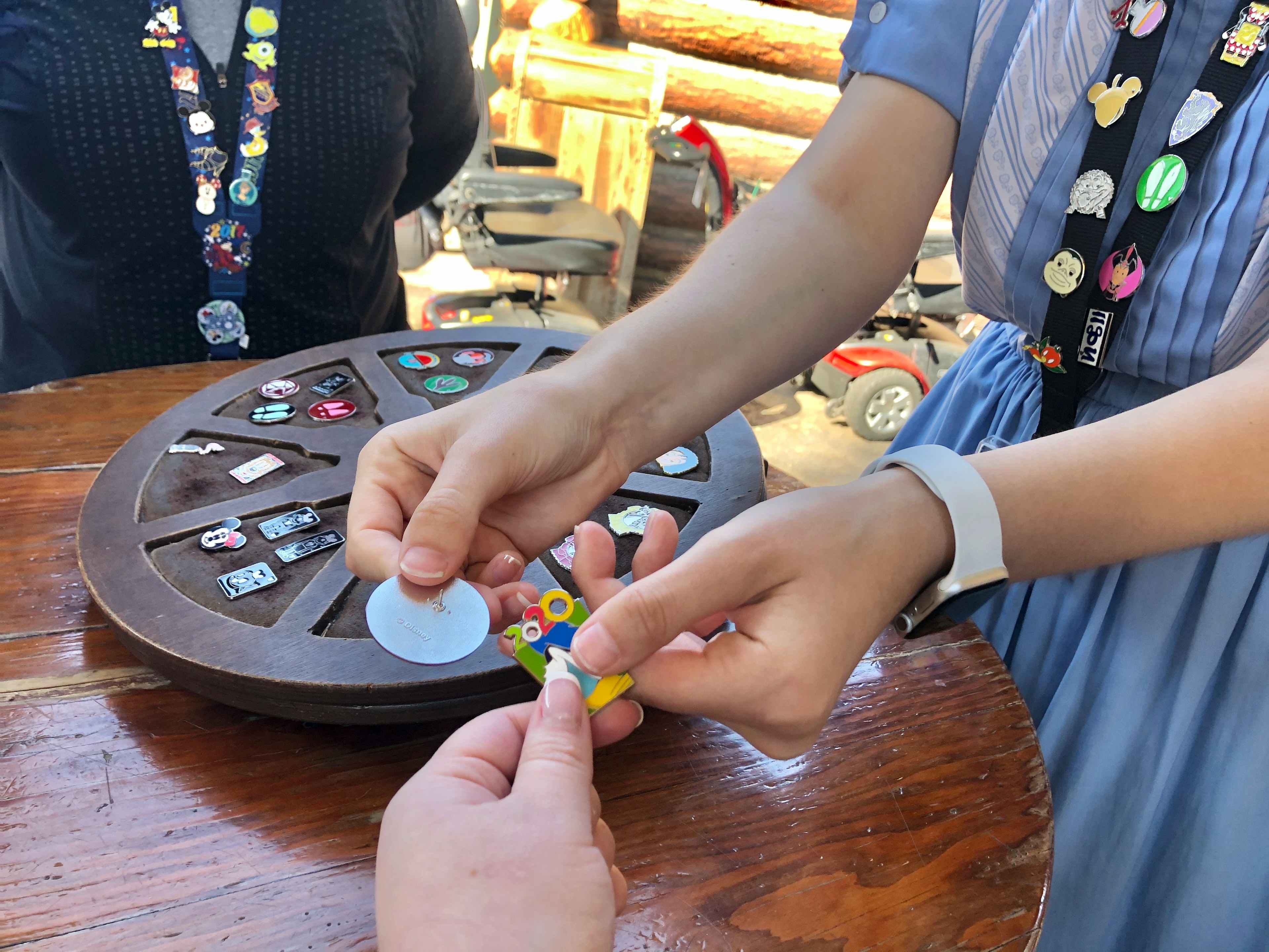 Pins are traded at Disneyland.