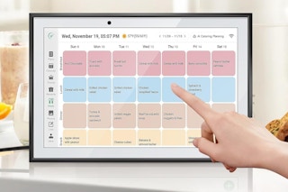 a woman using a digital calendar