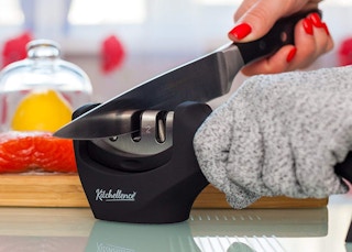 someone sharpening a knife