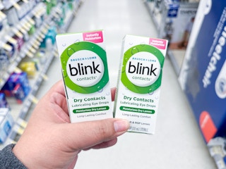 hand holding blink eye drops in walgreens