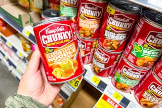 hand holding a can of campbell's soup