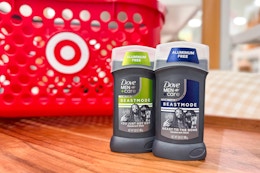 two dove men care beastmode deodorant sitting on a shelf in front of a target basket 
