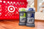 two dove men care beastmode deodorant sitting on a shelf in front of a target basket