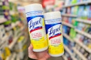 hand holding lysol disinfectant wipes