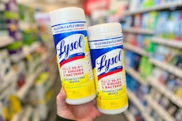 hand holding lysol disinfectant wipes