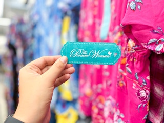 Hand holding The Pioneer Woman apparel tag