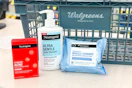 neutrogena skincare products in front of a walgreens shopping basket