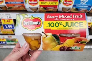 hand holding a pack of del monte fruit cups at kroger