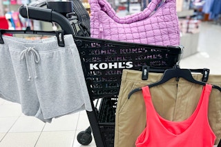 some kohl's items that are comparable to other, more expensive brands hanging on a Kohl's cart