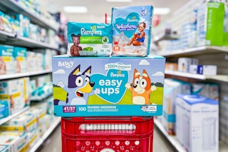 pampers diapers, wipes, and swim pants sitting on a target cart