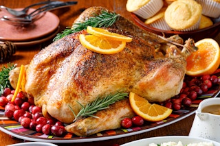 roasted thanksgiving turkey and sides on table