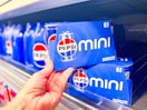 hand holding a Pepsi mini can pack