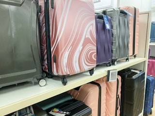 a display of luggages on a shelf