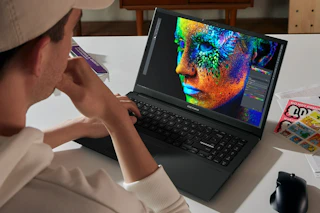 man working on a laptop on a table