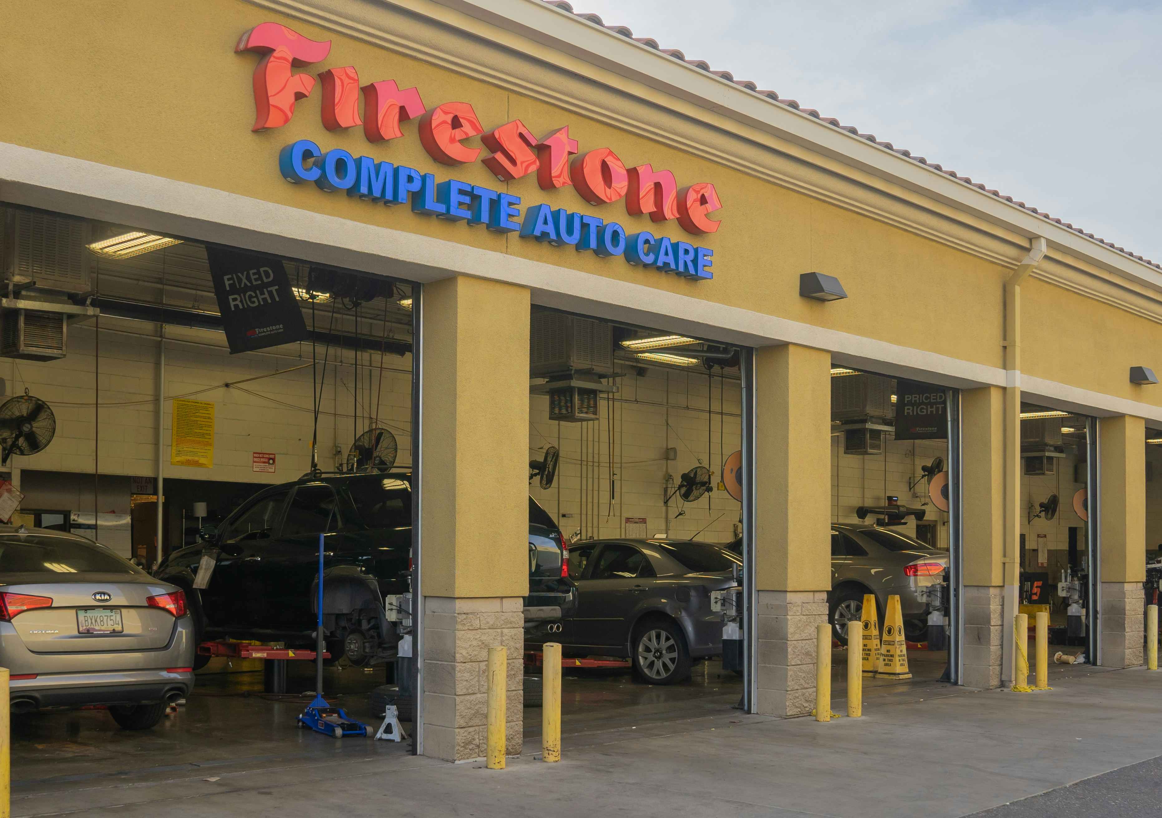 Cars in a Firestone Complete Auto Care shop