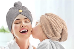 a woman and child wearing hair towels