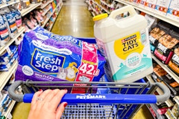 person pushing a cart with fresh step and tidy cats litter in it
