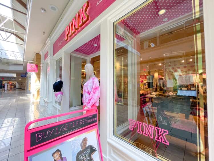 Victoria's Secret pink storefront with backpack sale sign