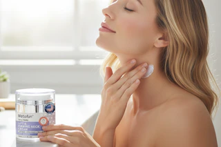 a woman applying neck cream