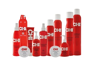 Red and grey bottles of hair products on a white background