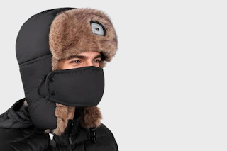 a man wearing a trapper hat