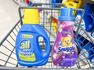 bottle of all laundry detergent and snuggle fabric softneer in shoppin cart
