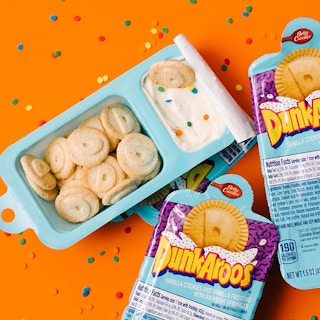 A set of three Dunkaroos cookies with frosting.