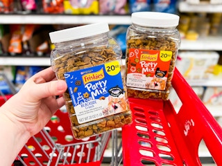two boxes of friskies cat treats in a target cart