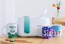 cricut mug press sitting on a table