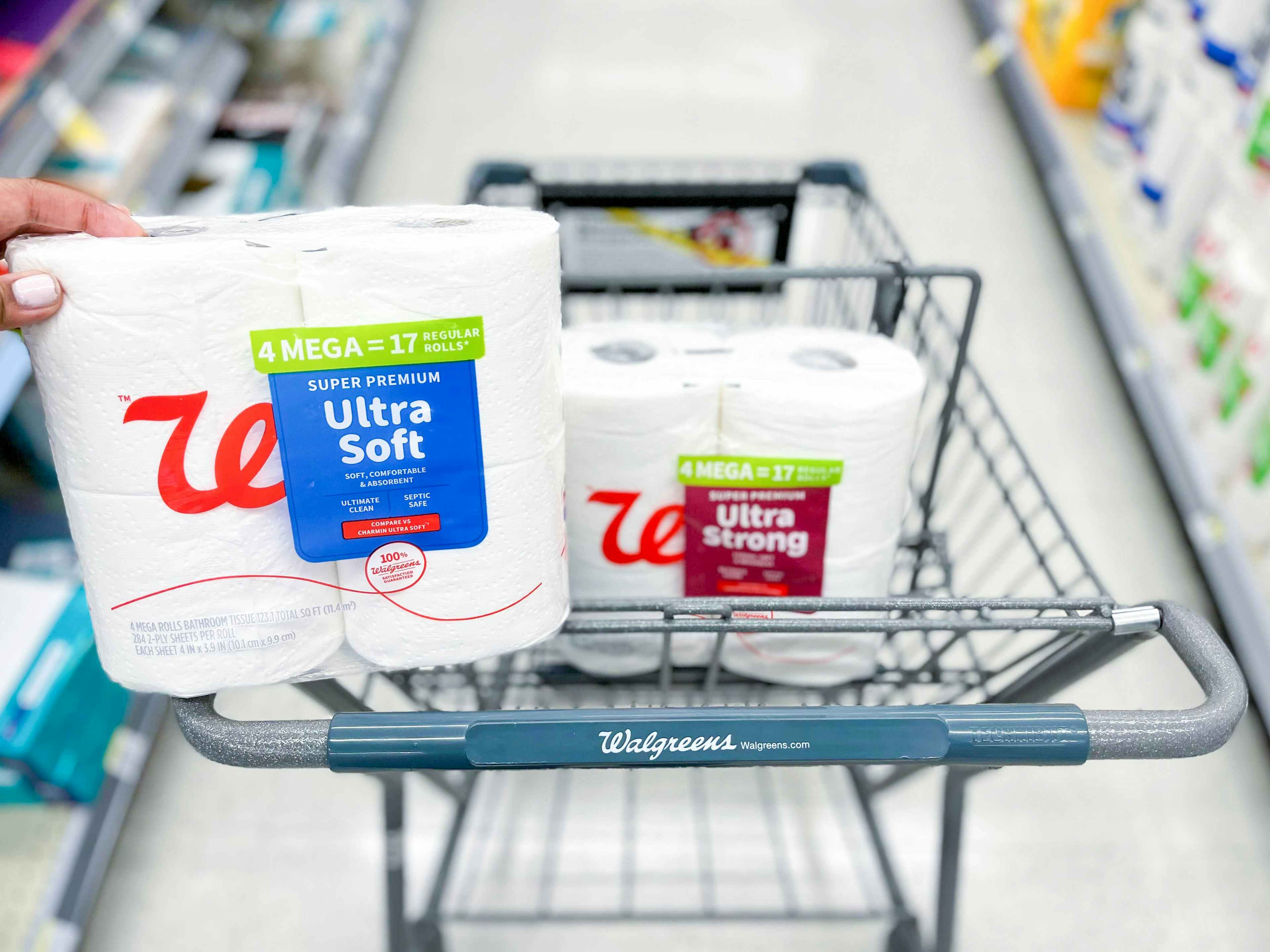 shopping cart with two packs of Walgreens toilet paper