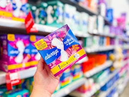 A pack of Always Radiant FlexFoam Pads (15-count) held up in feminine hygiene aisle